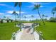 Common area with benches and views of the water on a bright sunny day at 655 Spanish Way, Longboat Key, FL 34228