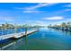 View of the docks along the community's waterway on a clear day at 655 Spanish Way, Longboat Key, FL 34228