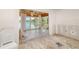 Renovation in progress showcasing water views through the sliding glass doors at 655 Spanish Way, Longboat Key, FL 34228