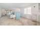 Living room featuring large windows with water view and undergoing renovation at 655 Spanish Way, Longboat Key, FL 34228