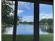 The canal-side view through the screen windows showcases the tranquility of waterfront living at 655 Spanish Way, Longboat Key, FL 34228