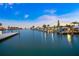 Picturesque waterfront view with multiple boat docks and beautiful sunset reflection in the water at 655 Spanish Way, Longboat Key, FL 34228