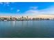 Scenic waterfront featuring multiple boat docks with boats against the setting sun at 655 Spanish Way, Longboat Key, FL 34228