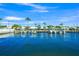 Waterfront view of the community's homes and boats docked on the waterway at 655 Spanish Way, Longboat Key, FL 34228