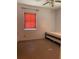 Minimalist bedroom with a twin bed, window, and clean design at 6803 Washington Pl, Bradenton, FL 34207