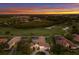Aerial shot of estate home overlooking lush golf course and serene landscaping at 7144 Ashland Gln, Lakewood Ranch, FL 34202