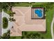 Aerial view of a luxury home featuring a private screened pool and expansive backyard at 7144 Ashland Gln, Lakewood Ranch, FL 34202