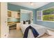 Charming bedroom with built-in desk, neutral carpet, and a cozy atmosphere for relaxation at 7144 Ashland Gln, Lakewood Ranch, FL 34202