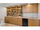 Home features custom built-ins, including shelving, cabinets, and a beverage refrigerator at 7144 Ashland Gln, Lakewood Ranch, FL 34202