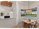 Dining area with view of the screened-in pool, spa and outdoors at 7144 Ashland Gln, Lakewood Ranch, FL 34202