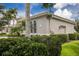 Elegant home exterior showcasing arched windows, a tile roof, and manicured landscaping at 7144 Ashland Gln, Lakewood Ranch, FL 34202