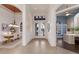 Spacious foyer showcasing an elegant dining area, leading to a bright office, enhancing the home's inviting layout at 7144 Ashland Gln, Lakewood Ranch, FL 34202