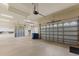 Spacious four-car garage offering ample storage and parking space with epoxy floors at 7144 Ashland Gln, Lakewood Ranch, FL 34202