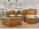 Gourmet kitchen featuring custom cabinetry, granite countertops, and stainless steel appliances at 7144 Ashland Gln, Lakewood Ranch, FL 34202