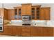 Kitchen with granite countertops, custom cabinets, tile backsplash and stainless steel appliances at 7144 Ashland Gln, Lakewood Ranch, FL 34202