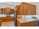 Updated kitchen featuring granite countertops, stainless steel appliances, and custom wood cabinets at 7144 Ashland Gln, Lakewood Ranch, FL 34202
