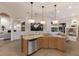 Kitchen area with granite countertops, stainless steel appliances, with view to the pool at 7144 Ashland Gln, Lakewood Ranch, FL 34202