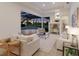 Bright living room featuring views of the pool and outdoor entertainment area at 7144 Ashland Gln, Lakewood Ranch, FL 34202