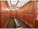 Well-maintained locker room with rows of wooden lockers, providing ample storage space for members and guests at 7144 Ashland Gln, Lakewood Ranch, FL 34202