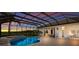 Screened-in pool and spa with views of the sunset from the outdoor living spaces at 7144 Ashland Gln, Lakewood Ranch, FL 34202