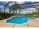 Screened-in pool and spa with view to the golf course at 7144 Ashland Gln, Lakewood Ranch, FL 34202