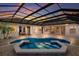 Stunning screened-in pool with integrated spa and brick patio, perfect for outdoor relaxation and entertaining at 7144 Ashland Gln, Lakewood Ranch, FL 34202