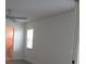 Bedroom featuring a window and doorway to the ensuite bathroom at 7157 Fairway Bend Cir, Sarasota, FL 34243