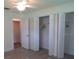 Bright bedroom with closets and a ceiling fan at 7157 Fairway Bend Cir, Sarasota, FL 34243