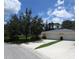 Charming home with a well-kept lawn, mature trees, and a convenient two-car garage at 7157 Fairway Bend Cir, Sarasota, FL 34243