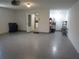 This two car garage has plank flooring, access to a utility room and storage at 7157 Fairway Bend Cir, Sarasota, FL 34243