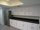 Kitchen featuring stainless appliances, granite counters, and many white cabinets for storage at 7157 Fairway Bend Cir, Sarasota, FL 34243