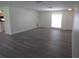 Bright living room with new flooring and large windows for natural light at 7157 Fairway Bend Cir, Sarasota, FL 34243