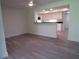 Bright living room featuring modern flooring and open view to a bright kitchen at 7157 Fairway Bend Cir, Sarasota, FL 34243