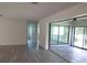 Bright, open room with wood floors and access to a sunroom at 7157 Fairway Bend Cir, Sarasota, FL 34243