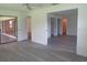 Spacious primary bedroom with sleek floors and a doorway to a walk-in closet and ensuite at 7157 Fairway Bend Cir, Sarasota, FL 34243