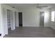 Large primary bedroom with luxury vinyl flooring, a ceiling fan and access to a bathroom at 7157 Fairway Bend Cir, Sarasota, FL 34243