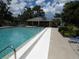 Relaxing community pool with ample seating and lush landscaping at 7157 Fairway Bend Cir, Sarasota, FL 34243