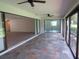 Relaxing sunroom with tile floors and large windows offering a view of the outside at 7157 Fairway Bend Cir, Sarasota, FL 34243