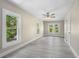 Bedroom featuring a ceiling fan, neutral colored walls and trim, and an abundance of natural light at 719 22Nd W St, Bradenton, FL 34205