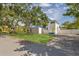Charming two-story home boasts a spacious front yard and a vibrant blue roof at 719 22Nd W St, Bradenton, FL 34205