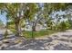 Attractive home featuring a well-manicured lawn and mature shade trees on a corner lot at 719 22Nd W St, Bradenton, FL 34205
