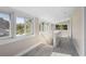 Hallway filled with natural light from an abundance of windows and neutral colored walls at 719 22Nd W St, Bradenton, FL 34205