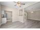 Bright living room with new floors flows into the kitchen, promoting an open layout at 719 22Nd W St, Bradenton, FL 34205
