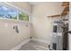 Efficient utility room featuring a window, water heater, and space for laundry at 719 22Nd W St, Bradenton, FL 34205