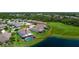Expansive aerial view of the home and lot backing up to a pond, highlighting the large yard and mature trees at 7364 47Th Avenue E Cir, Bradenton, FL 34203