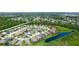 Wide aerial view of the home showing proximity to other homes and a pond at 7364 47Th Avenue E Cir, Bradenton, FL 34203