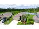 Aerial shot of a single-Gathering home with a well-manicured lawn and scenic pond views at 7364 47Th Avenue E Cir, Bradenton, FL 34203