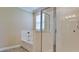 Bright bathroom featuring a tub with tile surround, a separate glass shower, and a window at 7364 47Th Avenue E Cir, Bradenton, FL 34203