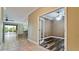 View of the bedroom with the kitchen in the background, separated by an open door to the office at 7364 47Th Avenue E Cir, Bradenton, FL 34203