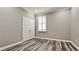 Empty bedroom with laminate floors, a double closet, neutral colors, and natural light at 7364 47Th Avenue E Cir, Bradenton, FL 34203